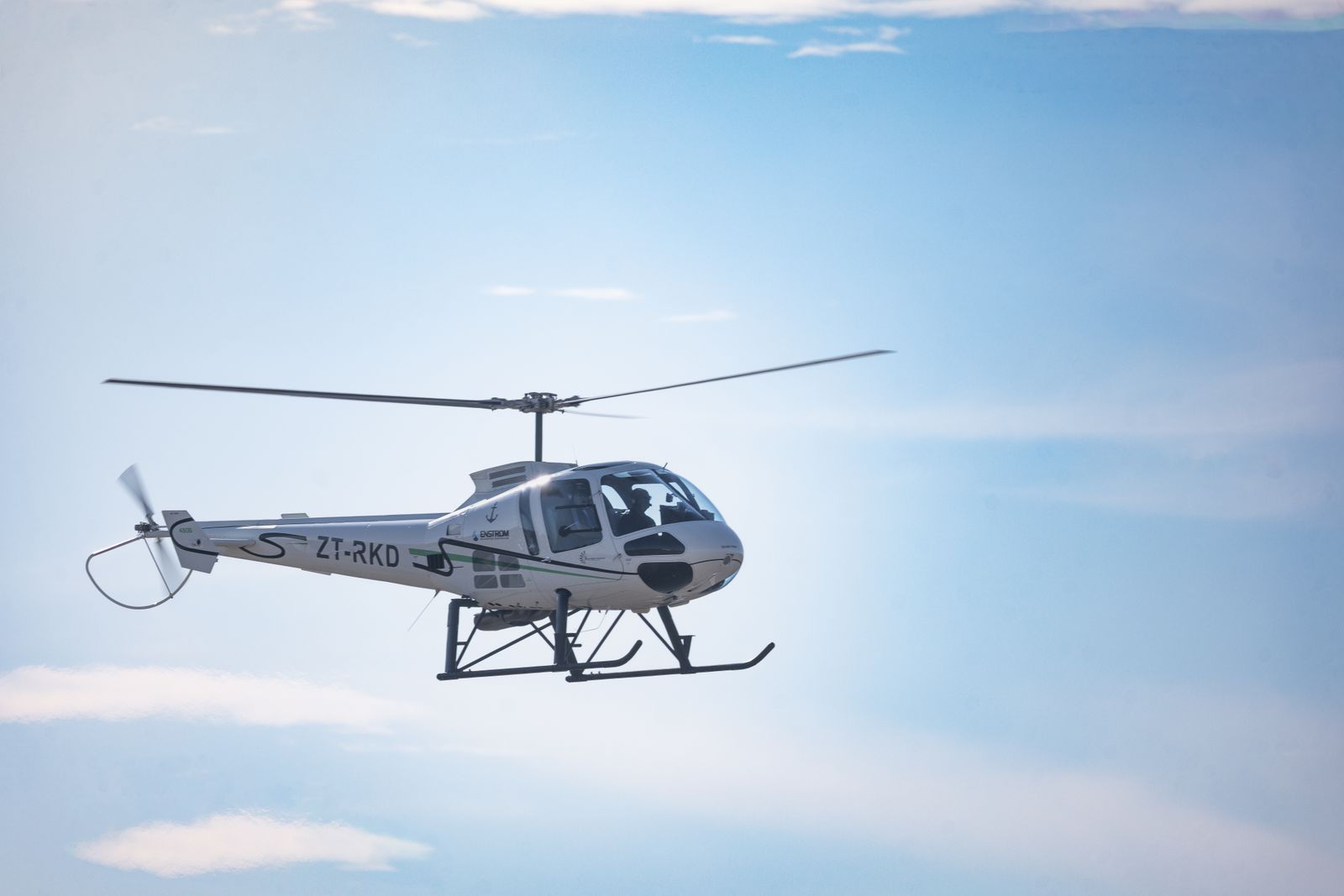Helicopter in flight against a clear sky